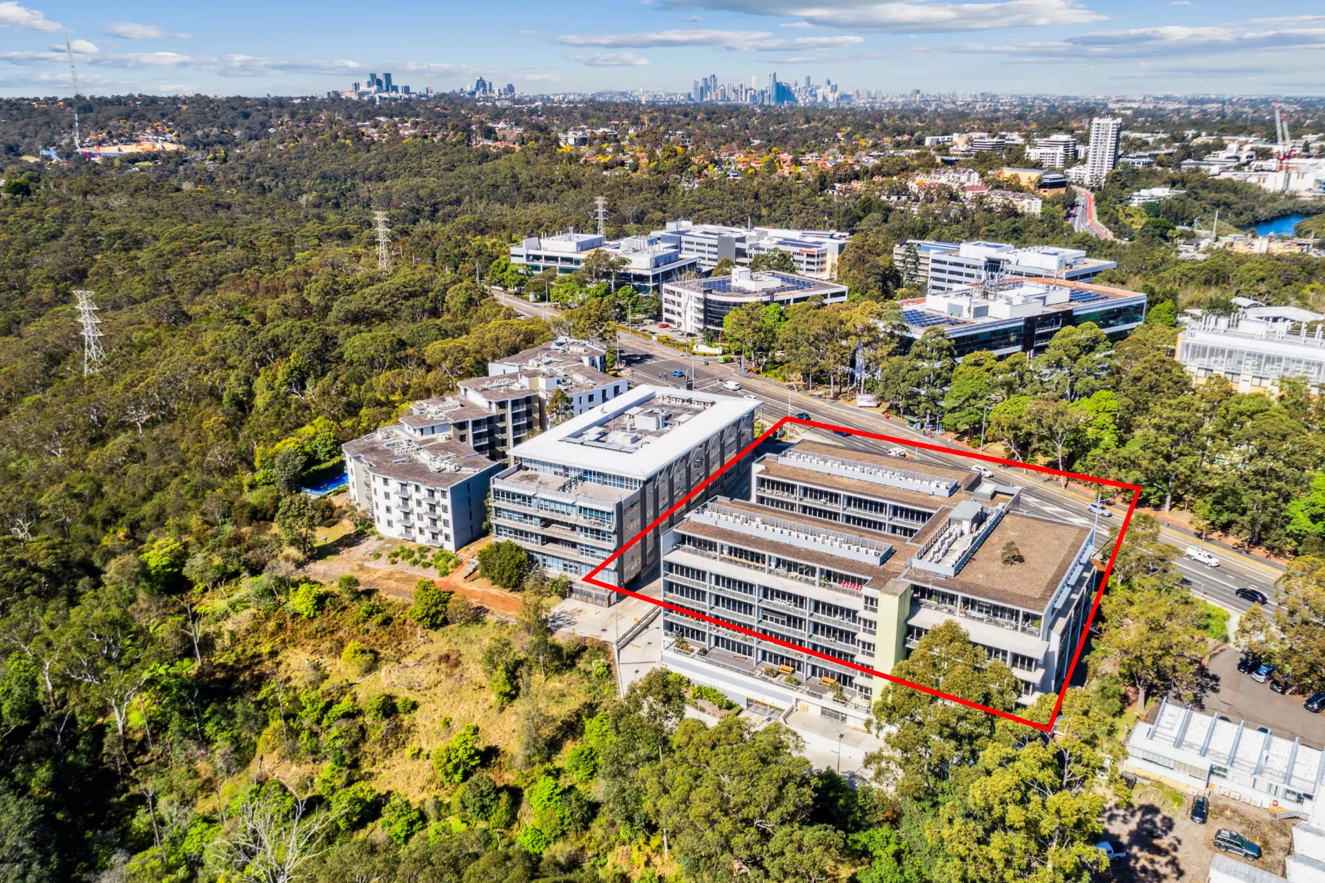 Aerial view identifying 32 Delhi Road within its surrounding business and parkland setting.